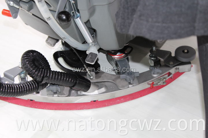 Rotating floor dry cleaning machine with single brush